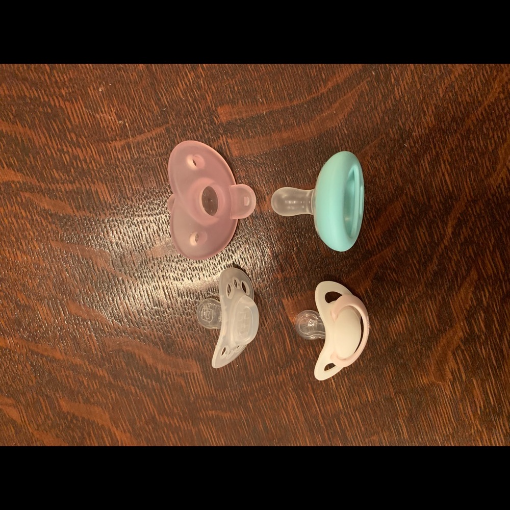 Pacifiers 4 different brands. 0-6 months. Unused